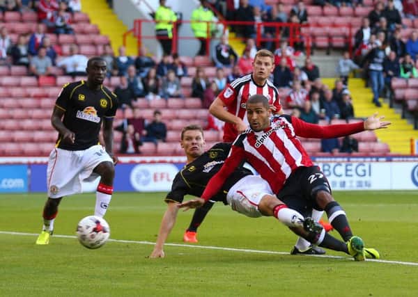 Leon Clarke of Sheffield United scores the first goal.