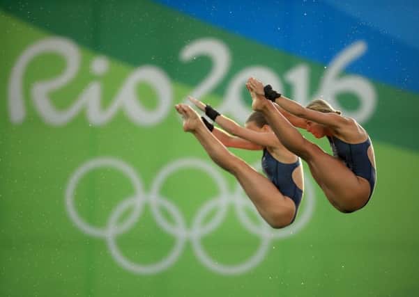 Britain's Lois Toulson and Tonia Couch compete during the women's synchronized 10m platform diving final