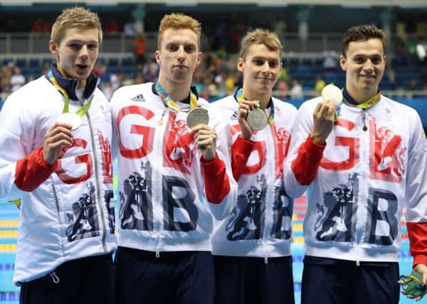 Great Britain's James Guy, Stephen Milne, Duncan Scott and Dan Wallace with their silver medals in the men's 4 x 200m freestyle final