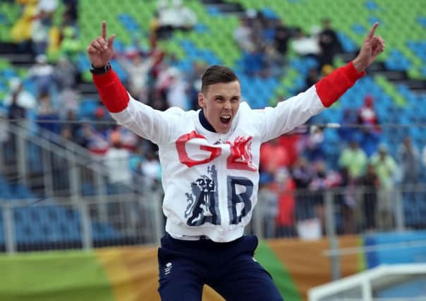 Leap of joy: Great Britains Joe Clarke, an unlikely hero, celebrates gold in the Kayak (K1) Mens final on the fifth day of the Rio Olympics