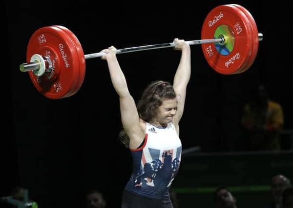 Rebekah Tiler, of Great Britain, competes in the women's 69kg weightlifting competition at the 2016 Summer Olympics in Rio de Janeiro, Brazil. (AP Photo/Mike Groll)