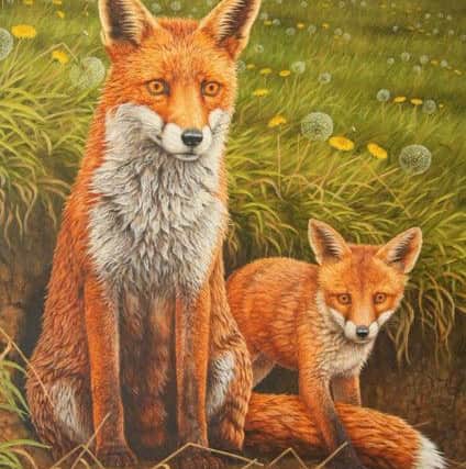 Roberts painting of a fox and her cub.