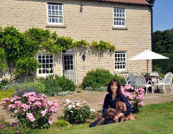 Georgie Pridden with the family dogs outside her home Nunnington.