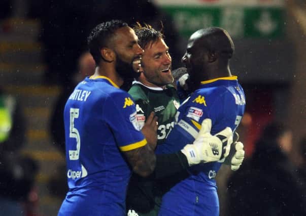 Leeds United's penalty shootout hero Rob Green is acclaimed by Kyle Bartley, left, and Sol Bamba (Picture: Tony Johnson).
