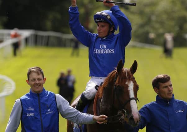 William Buick celebrates on Hawkbill after winning the The Coral-Eclipse Race during Coral-Eclipse Day at Sandown