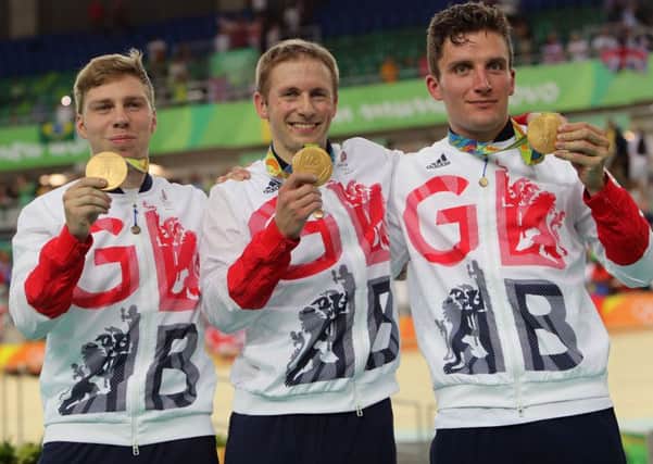 Great Britain's Philip Hindes, Jason Kenny and Callum Skinner with their gold medals following the men's team sprint cycling final