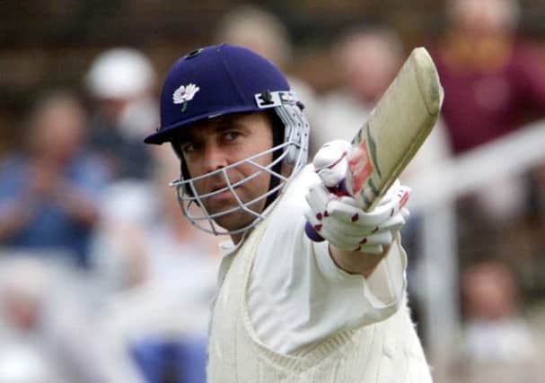 Yorkshire's Darren Lehmann celebrates a century during his playing days with the county.