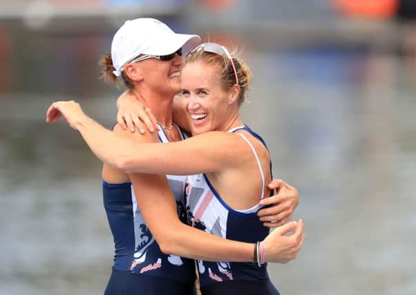Great Britain's Helen Glover and Heather Stanning celebrate winning gold in the Women's Pair at The Lagoa Stadium.