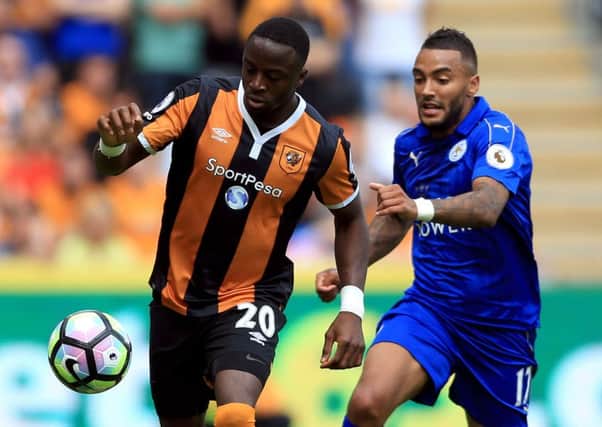 Leicester City's Danny Simpson (right) and Hull City's Adama Diomande battle for the ball.