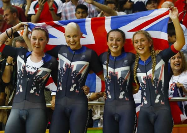 Britain's team, from left, Katie Archibald, Joanna Rowsell Shand, Elinor Barker and Laura Trott celebrate after winning gold in the women's team pursuit finals cycling event at the Rio Olympic Velodrome during the 2016 Summer Olympics in Rio.