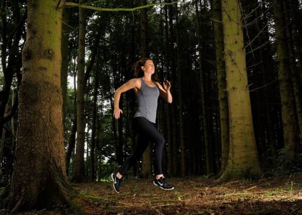 Jodie McGregor running thorugh woods at Middleton Tyas.