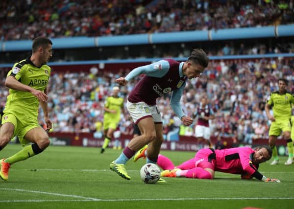 Aston Villa's Jack Grealish scores his side's third goal, beating Rotherham United goalkeeper Lee Camp. Picture: Nick Potts/PA.