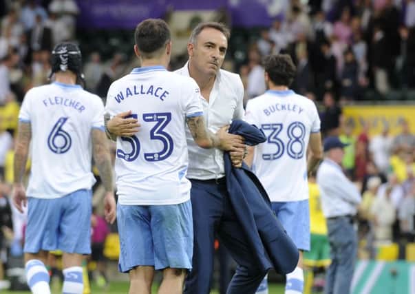 PLENTY TO PONDER: Owls coach Carlos Carvalhal, pictured with Ross Wallace, has to deal with the situation regarding star man, Fernando Forestieri. Picture: Steve Ellis