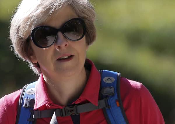 Theresa May has much to ponder during her walking holiday in the Swiss Alps.