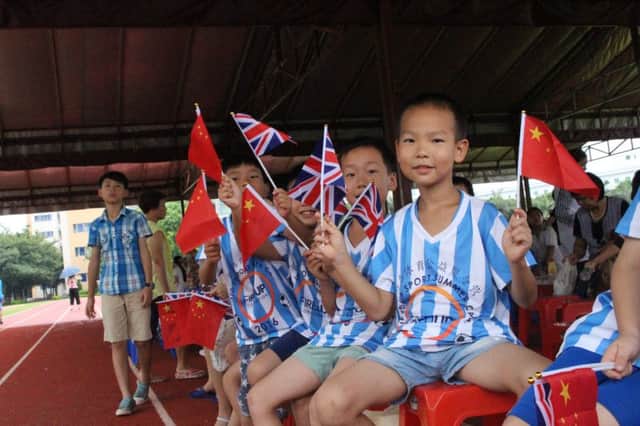 Huddersfield Town Football Club has teamed up with local business partner Fired Up Corporation to deliver a football coaching programme for local children in China