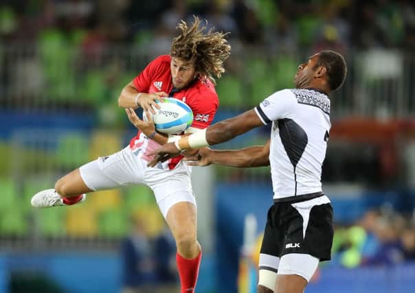 Great Britain's Daniel Bibby (left) and Fiji's Jasa Veremalua in action during the Rugby Sevens Men's Gold Medal Match between Fiji and Great Britain at the Deodoro Stadium on the sixth day of the Rio Olympic Games, Brazil. (Picture: Owen Humphreys/PA Wire)