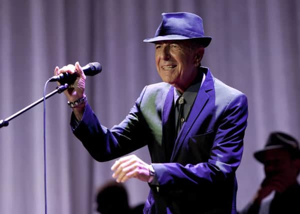 Leonard Cohen performing on stage at Wembley Arena. PA Wire/PA Wire