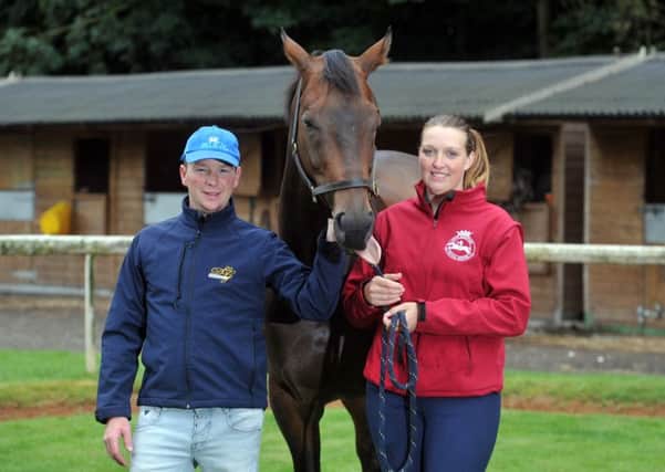 Expert trainers: David and Sophie Griffiths with star sprinter Take Cover in their yard at Bawtry. (Picture: Tony Johnson).