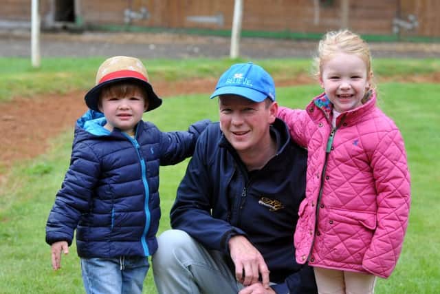 David Griffiths with his children in his yard at Bawtry.