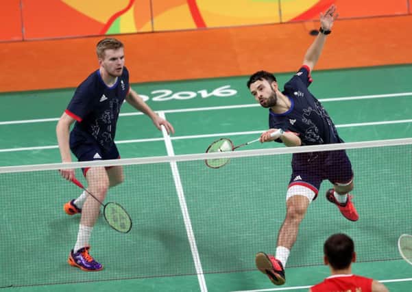 Great Britain's Chris Langridge (right) and Marcus Ellis take on China's HF Fu and N Zhang during the men's badminton quarter finals.