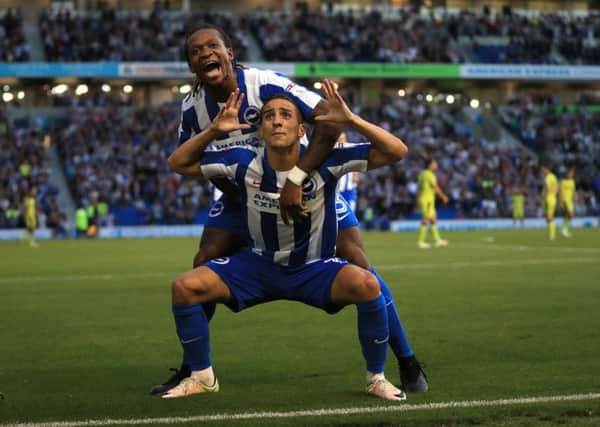 Brighton and Hove Albion's Anthony Knockaert, (left) celebrates scoring his side's first goal of the game.