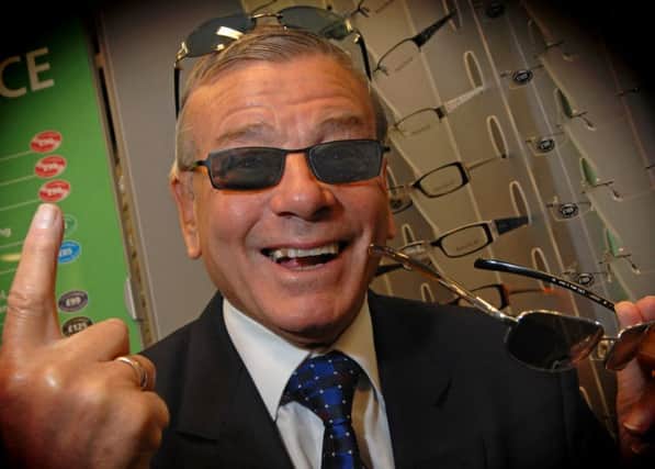 Yorkshire cricket umpire Dickie Bird tries out the frames at Specsavers