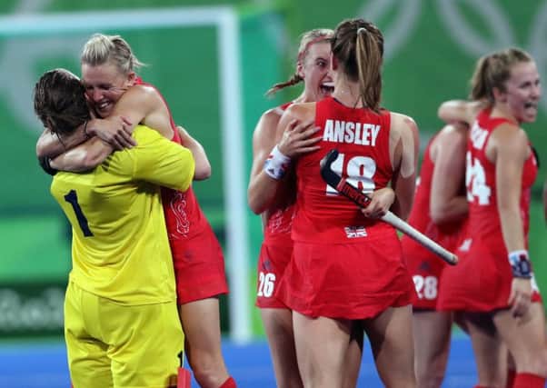 Great Britain's players celebrate at the end of the match.