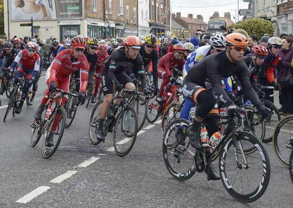 Cyclists make their way through the streets of Market Weighton during the first stage race in the Tour de Yorkshire