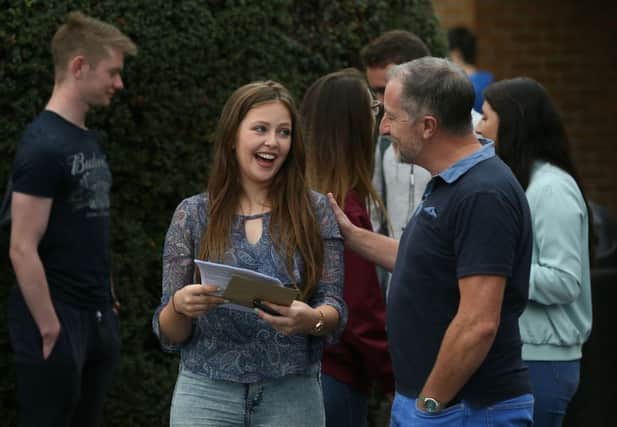 Fionnuala Moran, deputy head girl, smiles after collecting her Leaving Certificate exam results at Mount Temple School in Dublin.