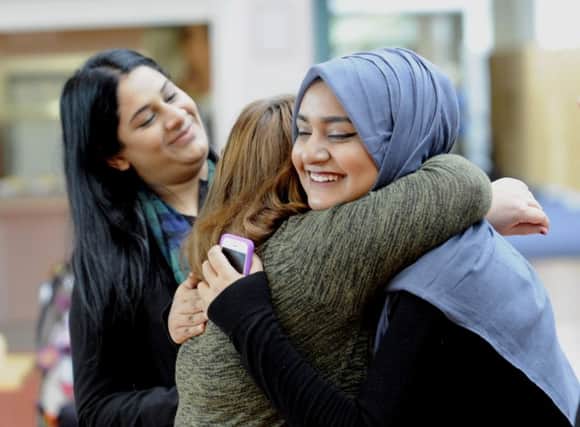 Students check their results at Allerton Grange School in Leeds