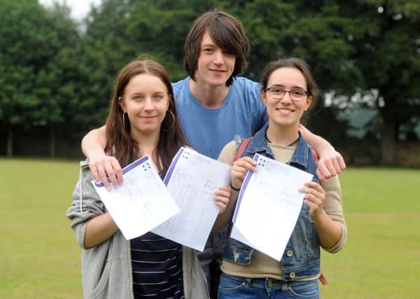 Amanda Ciarka , Roddy Macsween and Maddi Gomez-Iradi celebrate  their  A Levels results at Roundhay School, Leeds. Picture Tony Johnson