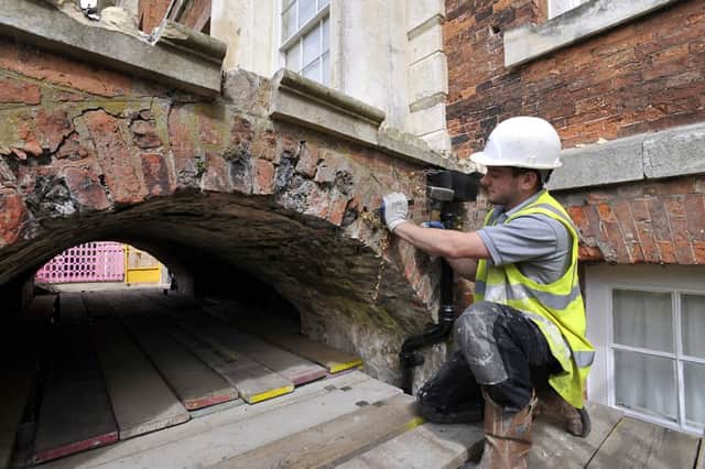 Alex Carter of William Anelay Restoration Specialists, York,working on a bridge that supports steps on the South entrance to Beningbrough Hall.