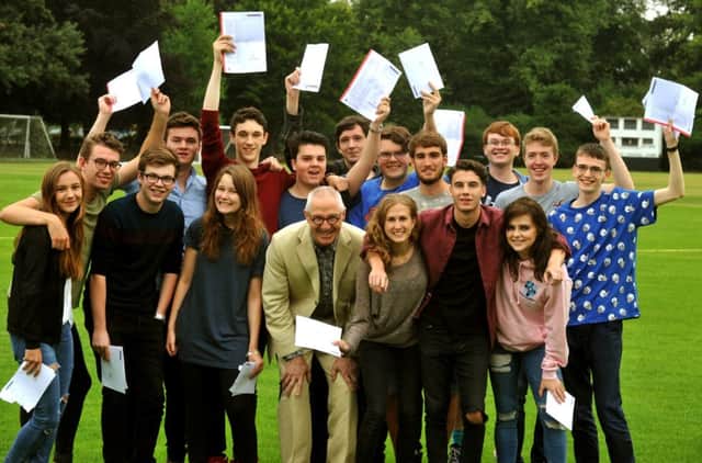 Students at Bootham School in York celebrate their A level results with retiring headmaster, Jonathan Taylor.