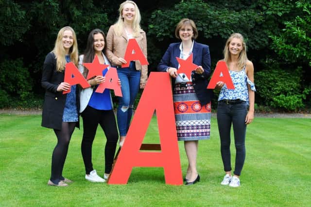 Sylvia Brett, Principal of Harrogate Ladies College joins pupils to celebrate an impressive set of A level results
