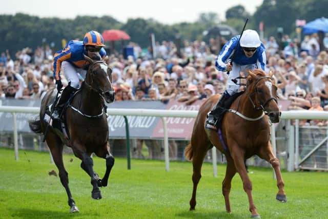 Queen Kindly ridden by Jamie Spencer (right) beats Roly Poly ridden by Seamie Heffernan to win the Sky Bet Lowther Stakes during day two of the Ebor Festival. Picture: Anna Gowthorpe/PA