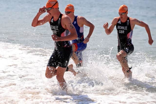 FOLLOW MY LEADER: Alistair Brownlee (left) and brother Jonny Brownlee (right) exit the water during the Men's Triathlon. Picture: Mike Egerton/PA.