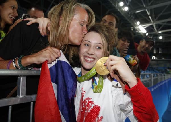 Great Britain's Jade Jones with her mother as she celebrates a gold medal in the women's 57kg taekwondo
