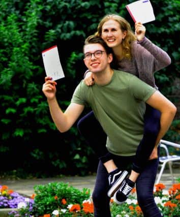 180816   Bootham School head girl Holly Jeffrey and head of the student council Andrew Hodgson have secured Oxbridge places  , with Holly going to Clare College Cambridge and  Andrew to Wadham College Oxford , pictured celebrating their A level reults at Bootham School in York.