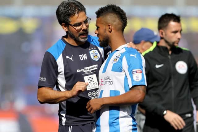 Huddersfield Town manager David Wagner with Elias Kachunga during the Sky Bet Championship match at the John Smith's Stadium, Huddersfield. PRESS ASSOCIATION Photo. Picture date: Saturday August 6, 2016. See PA story SOCCER Huddersfield. Photo credit should read: Richard Sellers/PA Wire. RESTRICTIONS: EDITORIAL USE ONLY No use with unauthorised audio, video, data, fixture lists, club/league logos or "live" services. Online in-match use limited to 75 images, no video emulation. No use in betting, games or single club/league/player publications.