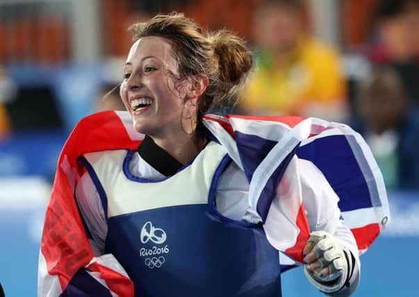 Jade Jones celebrates after defending her Olympic title.