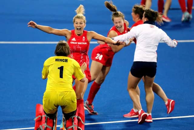 Great Britain's Maddie Hinch, Hollie Webb (second left) and their team-mates celebrate winning the gold medal match. Picture: Owen Humphreys/PA.