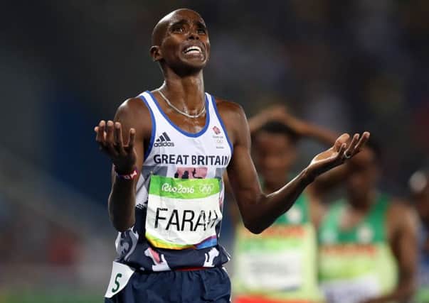 Great Britain's Mo Farah celebrates winning the Men's 5000m final at the Olympic Stadium