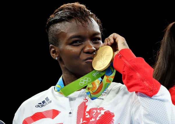 Great Britain's Nicola Adams with her gold medal following victory over France's Sarah Ourahmoune