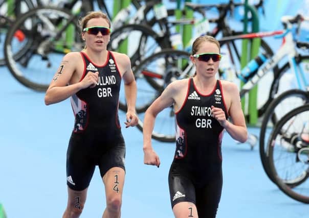 Vicky Holland, left, and housemate Non Stanford, raced against each other for Olympic bronze on Saturday.