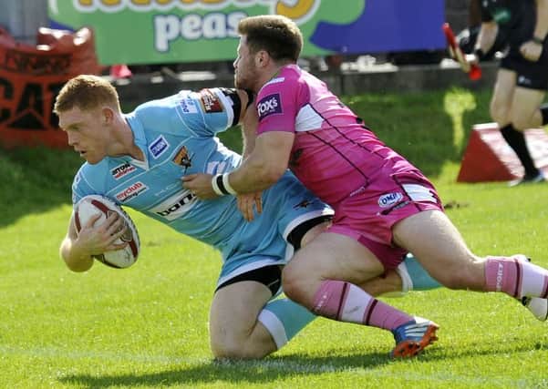 Tom Symonds scores a try for Huddersfield. Picture: Dave Williams.