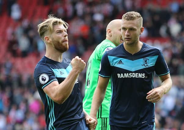 Middlesbrough's Adam Clayton, left, celebrates in front of supporters after victory over Sunderland (Picture: Richard Sellers/PA Wire).