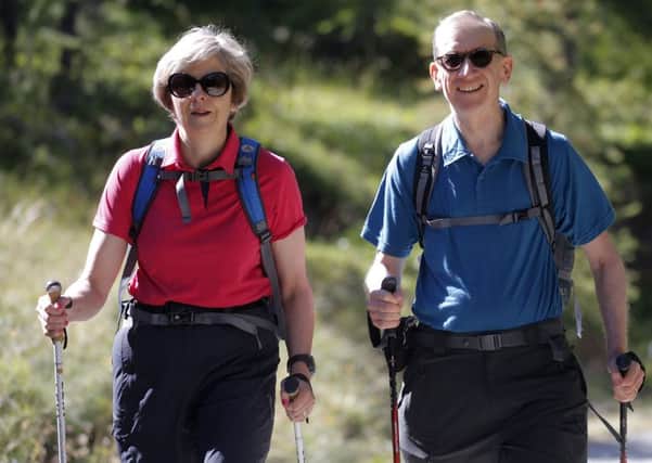 Theresa May on her Swiss walking holiday with her husband Philip.
