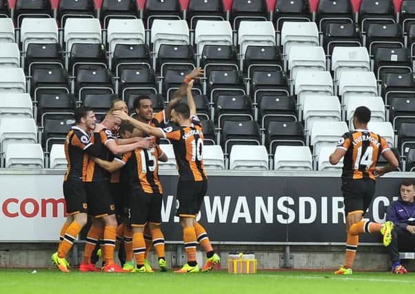 Hull City's Shaun Maloney celebrates scoring with team-mates against Swansea on Saturday.