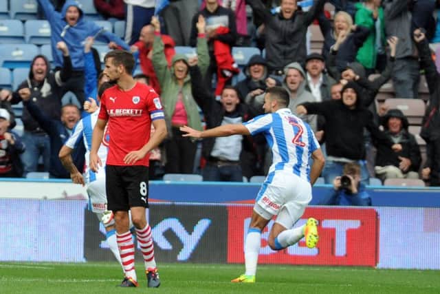 Huddersfield celebrate their late winner against Championship and county rivals Barnsley.