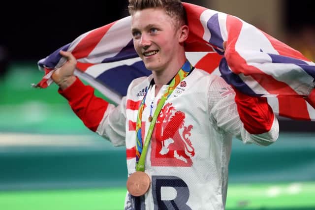HERO: Nile Wilson with his bronze medal in the men's horizontal bar. Picture: Owen Humphreys/PA